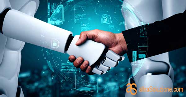 Un robot e un umano si stringono la mano